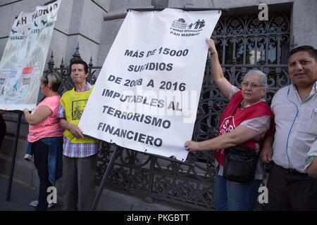 Madrid, Spain. 13th Sep, 2018. Members of the Anti-evictions Platform against the suicides of the financial crisis seen holding a banner during the protest.Activists have demonstrated at the Bank of Spain to demand greater citizen control over the financial system and have denounced the suicides caused by the economic crisis after 10 years of economic crisis in Spain. Credit: Lito Lizana/SOPA Images/ZUMA Wire/Alamy Live News Stock Photo