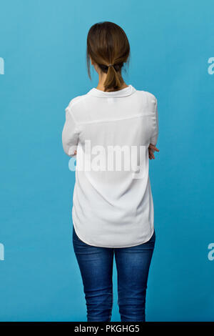 Young woman with brown hair back portrait. Rear view Stock Photo