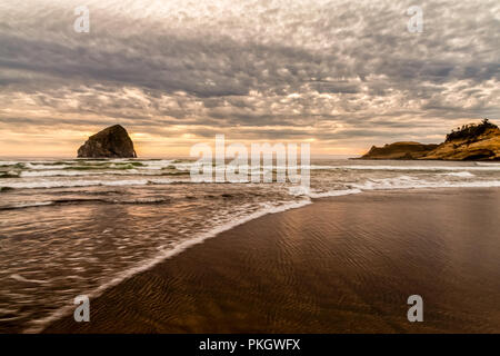 Cape Kiwanda, Oregon at sunrise and the tide coming in Stock Photo