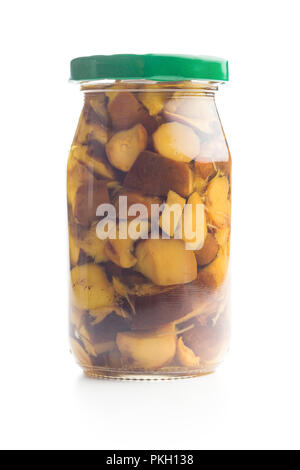 Pickled boletus in jar. Canned mushrooms isolated on white background. Stock Photo