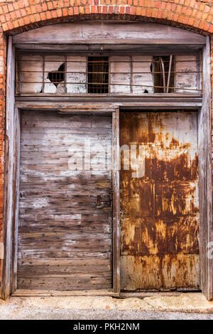 Rusted Metal and Wooden Door in an Alley in an Old Town in Georgia Stock Photo