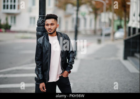 Biker in leather jacket posing with his scooter Stock Photo - Alamy