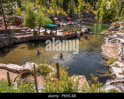 Bathers soak in the warm water, Strawberry Park Hot Springs, Steamboat Springs, Colorado. Stock Photo