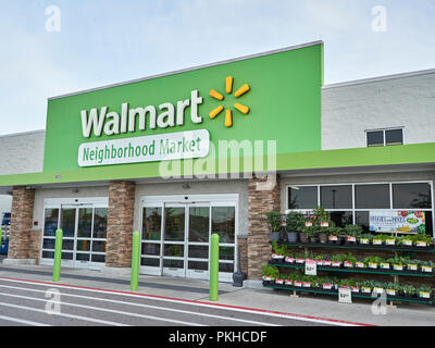 entrance to a Walmart neighborhood market in Bentonville AR, home town ...