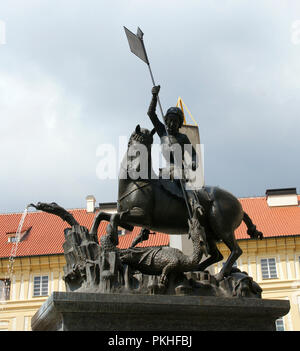 Czech Republic. Prague. Statue of St. George and a fountain. Gothic bronze statue was cast by George and Martin of Kluj. St. George killing a dragon. 1773. Prague Castle, Third Courtyard. Stock Photo