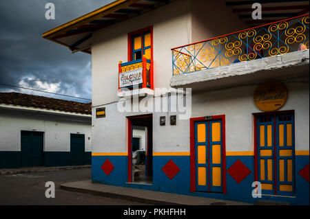 A brightly painted colonial house is seen before a rain storm in Jardín, a village in the coffee region (Zona cafetera) of Colombia, 24 April 2018. Stock Photo