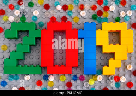 Tambov, Russian Federation - September 02, 2018 Number 2018 made from Lego bricks on gray baseplate with scattered Round Bricks 1x1. Studio shot. Stock Photo