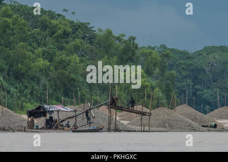 Gold mining along the Madre de Dios river in Peru.  In recent years mining has undergone a boom and become a serious environmental hazard. Stock Photo