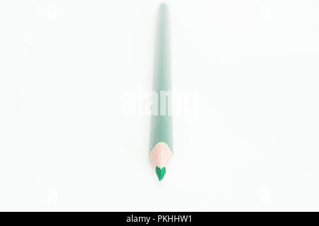 An isolated green colored pencil on a white background. Stock Photo