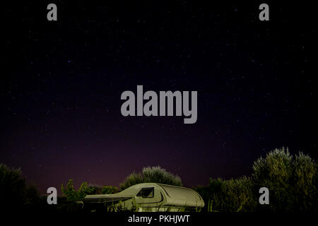 Camper van under starry sky Stock Photo - Alamy