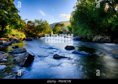 Afon Glaslyn in Snowdonia (Eryri), Wales (Cymru), UK, flowing past the village of Beddgelert. Stock Photo