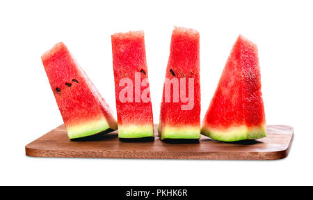 Four triangular wedges of watermelon on a wooden board Stock Photo