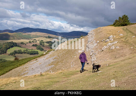 Hill walking on the limestone cliffs of Eglwyseg Escarpment above the Vale of Llangollen, Wales, UK Stock Photo