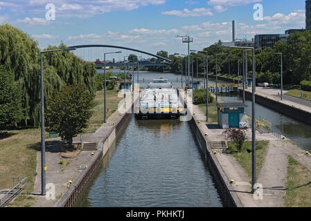 cargo ship in the barrage offenbach am main. Stock Photo