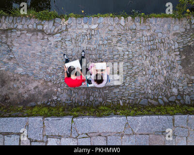 Aerial view of art students sketching by the lake at the entrance to Hongcun Village. Stock Photo