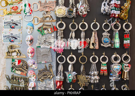 VENICE, ITALY - AUGUST 15, 2017: Magnet and keychain souvenirs background in a street shop in Venice, Italy Stock Photo