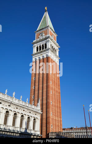 Saint Mark bell tower and National Marciana library facade, clear blue sky in Venice, Italy Stock Photo