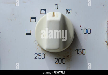 A white switch on oven for regulating warm in the inside oven. So switch on Stock Photo