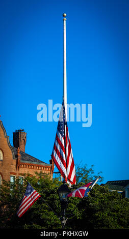 A flag pole with its US flag at half staff in Gettysburg, PA. Stock Photo