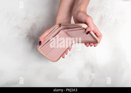 Female hands holding an empty wallet Stock Photo