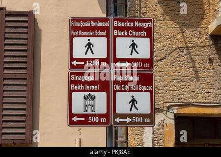 Generic tourist signs to major tourist attractions in Brasov, Romania. Stock Photo