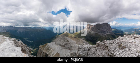 great Dolomite autumn landscape in Alta Badia with the Passo Sella and a view of the majestic Langkofel peak in the Val Gardena in northern Italy Stock Photo