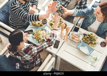 Delighted nice young people giving high five Stock Photo