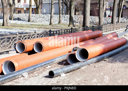 Corrugated water pipes of large diameter prepared for laying. Stock Photo