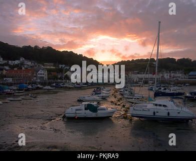 The marina at St Aubin on the channel island of Jersey, at a summer sunset and low tide. Stock Photo