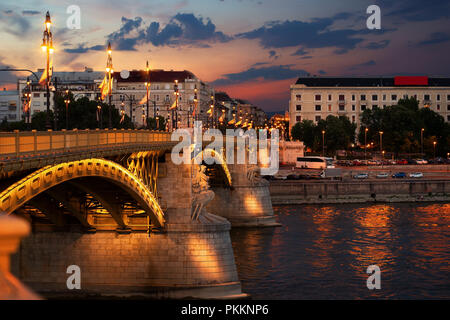 Illuminated Margaret Bridge on Danube river in Budapest Stock Photo