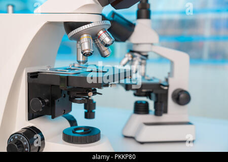 Four microscopes of different designs in the laboratory Stock Photo