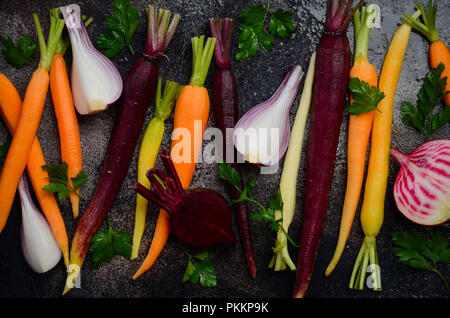 Fresh organic vegetables on old rusty baking sheet, ready for cooking, top view. Stock Photo