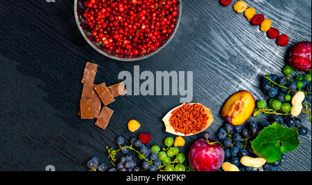 food for your health. Brain boosting health food background border with vegetables, seeds, nuts, fruit, herbs and pollen grain on slate. Foods high vi Stock Photo