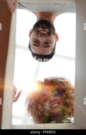 View from the bottom of the newlyweds looking inside the box. Stock Photo