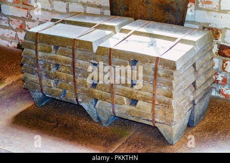 Stack of old raw aluminum ingots in an old foundry Stock Photo
