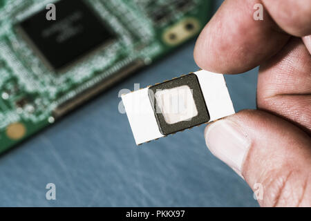 Silicon ceramic chip in the hand Stock Photo