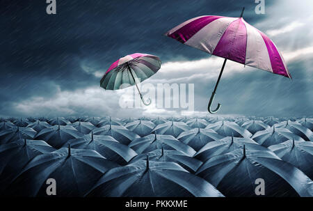 Pink and white umbrella in sky. Mixed media Stock Photo