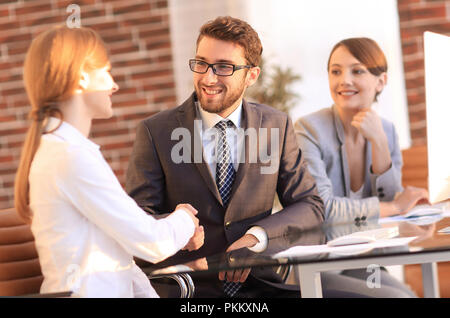 friendly handshake between colleagues in the office Stock Photo