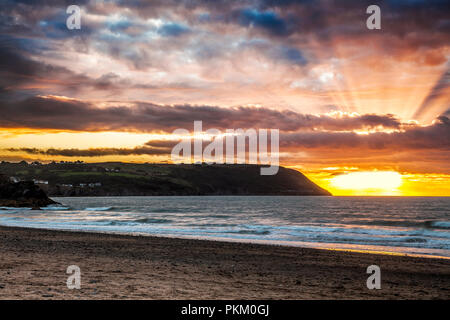 Sunset over Tresaith beach in Ceredigion, Wales, looking towards Aberporth. Stock Photo