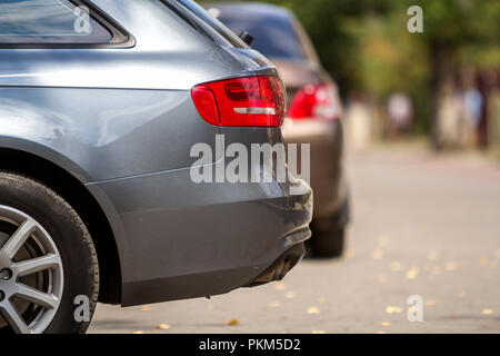 KYIV, UKRAINE - July 9, 2018: Vehicles design concept Close up side view details of new shiny luxurious silver car parked in recreation park district  Stock Photo