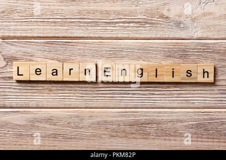 learn english word written on wood block. learn english text on table, concept. Stock Photo