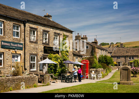 UK, Yorkshire, Wharfedale, Burnsall, shop, old phone box and tea room on village green Stock Photo