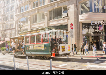 San Francisco, CA, USA, October 21st 2016: Tourists enjoying Powell Hyde cable car system transportation in a sunny day in San Francisco Stock Photo