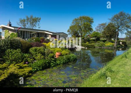 Lisse, Netherlands - 5 May 2018: A dutch villa along a pond Stock Photo