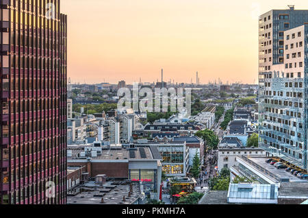 Rotterdam, The Netherlands, August 31, 2018: View between two skyscrapers along Binnenweg road towards the western neighbourhoods and, in the distance Stock Photo
