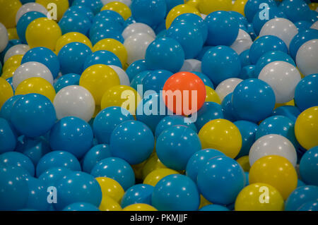 background with colorful plastic balls, red and yellow middle blue. Photos created the choice, competition, design ideas, office ... it is toys for ki