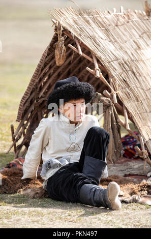 Lake Issyk-Kul, Kurgyzstan, 6th September 2018: local boy in full Kyrgyz outfit during World Nomad Games 2018 Stock Photo