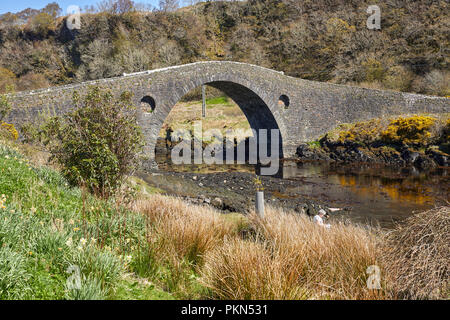 The Bridge Over the Atlantic or Clachan Bridge on the B844 road joins  Seil Island to the mainland spanning Clachan Sound. Argyll Stock Photo