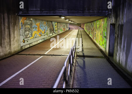 Tunnel with graffiti in bruges, detail of painting and decoration Stock Photo