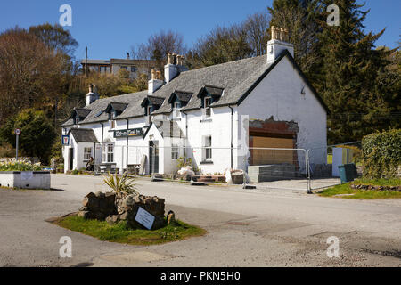 Bathed in bright spring sunshine, the 18th century Tigh-an-Truish Inn undergoing alterations prior to the season opening. Seil Island, Argyll Stock Photo
